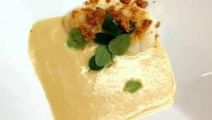 Seared diver scallop in Spanish onion/ saffron soup w crisp pork belly and oregano.